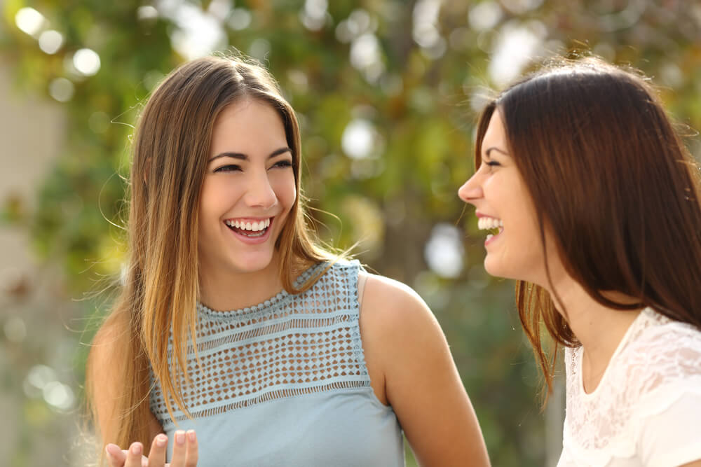 smiles after reaping benefits of invisalign